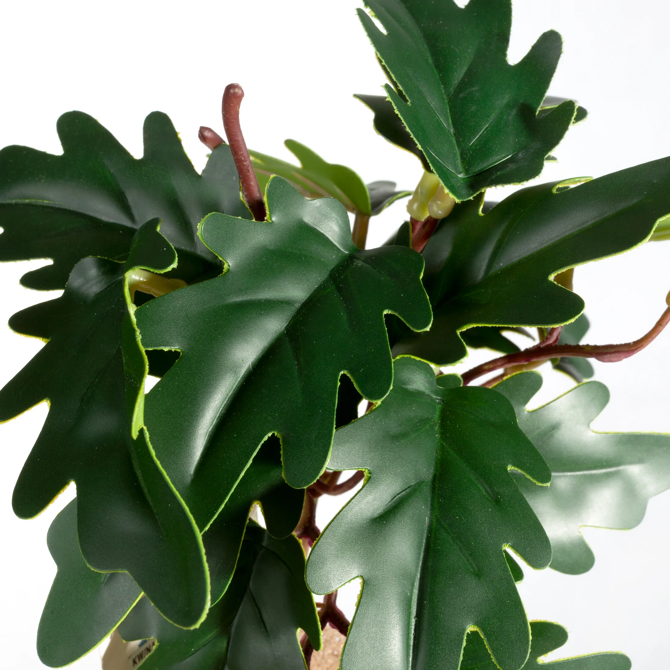 Kwiat sztuczny o ozdobnych zielonych liściach 20 cm