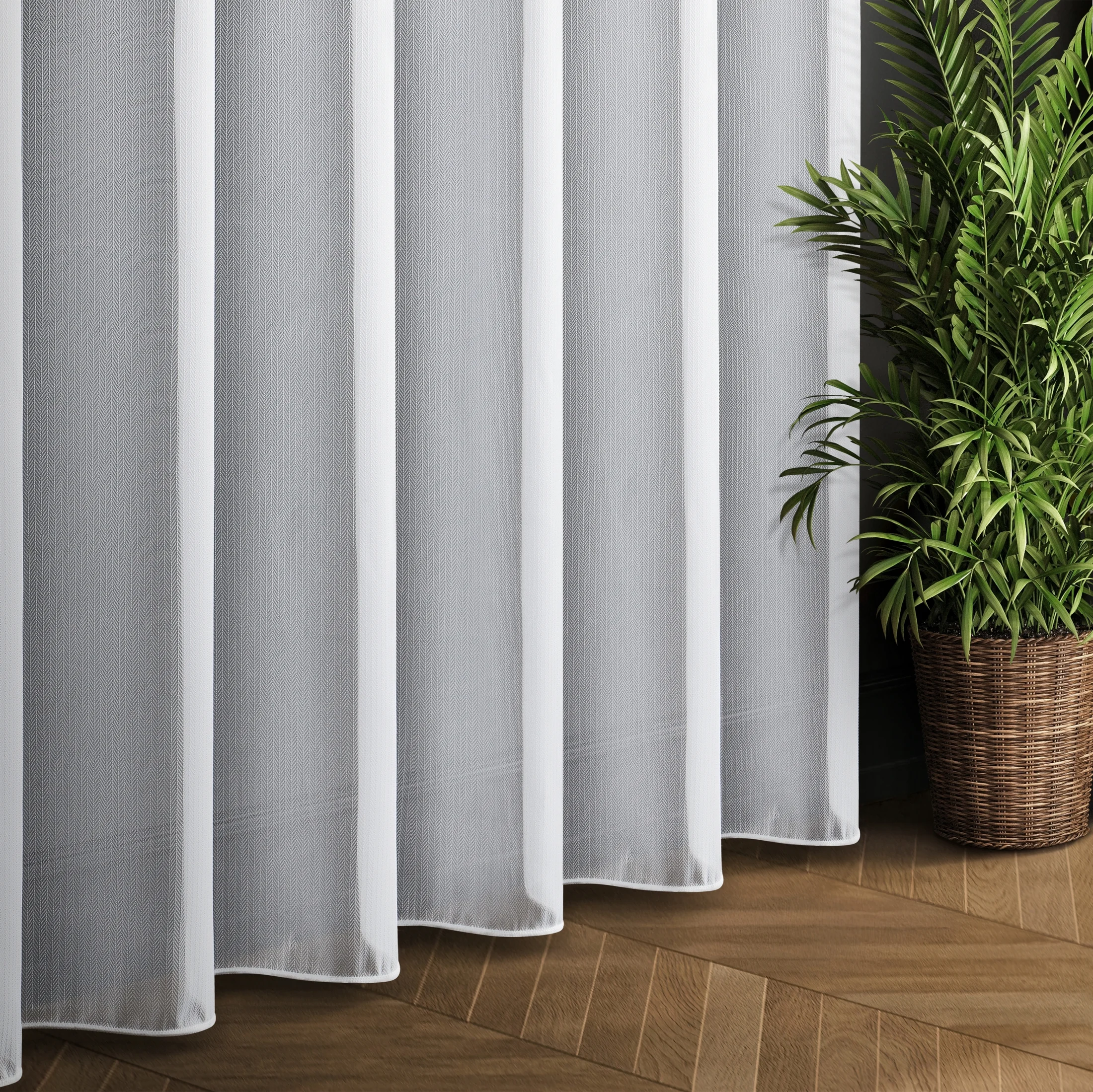 Tkanina firanowa o charakterystycznym splocie jodełki wykończona obciążnikiem