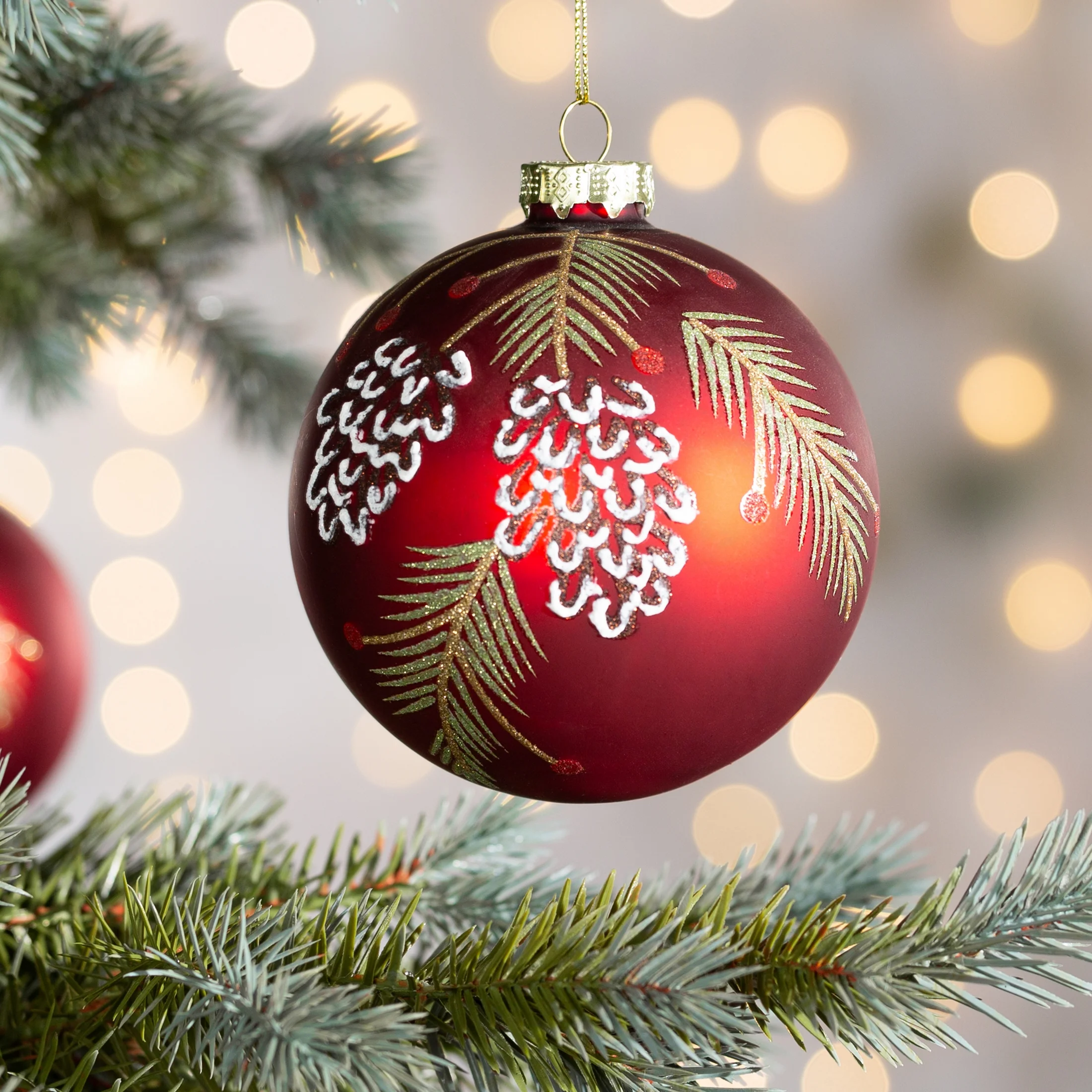 Szklana bombka choinkowa ręcznie zdobiona wzorem szyszek |