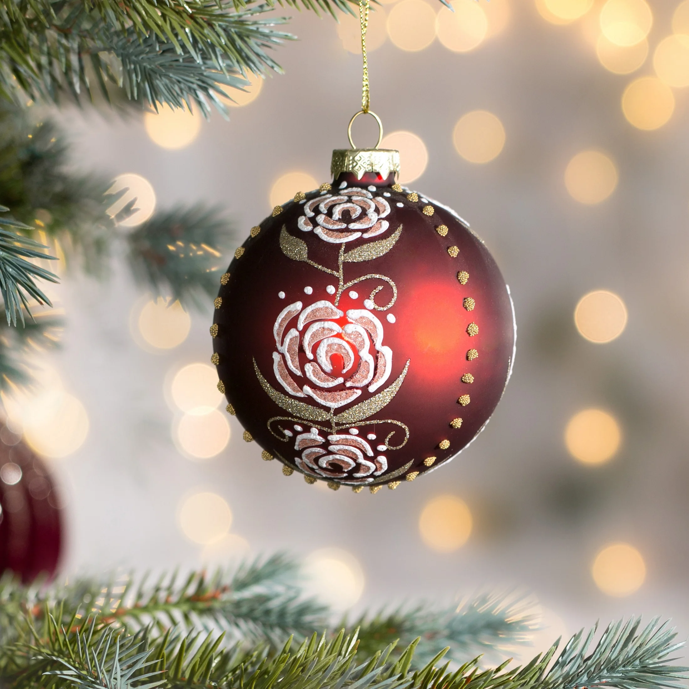 Szklana bombka choinkowa ręcznie zdobiona błyszczącym wzorem róży |