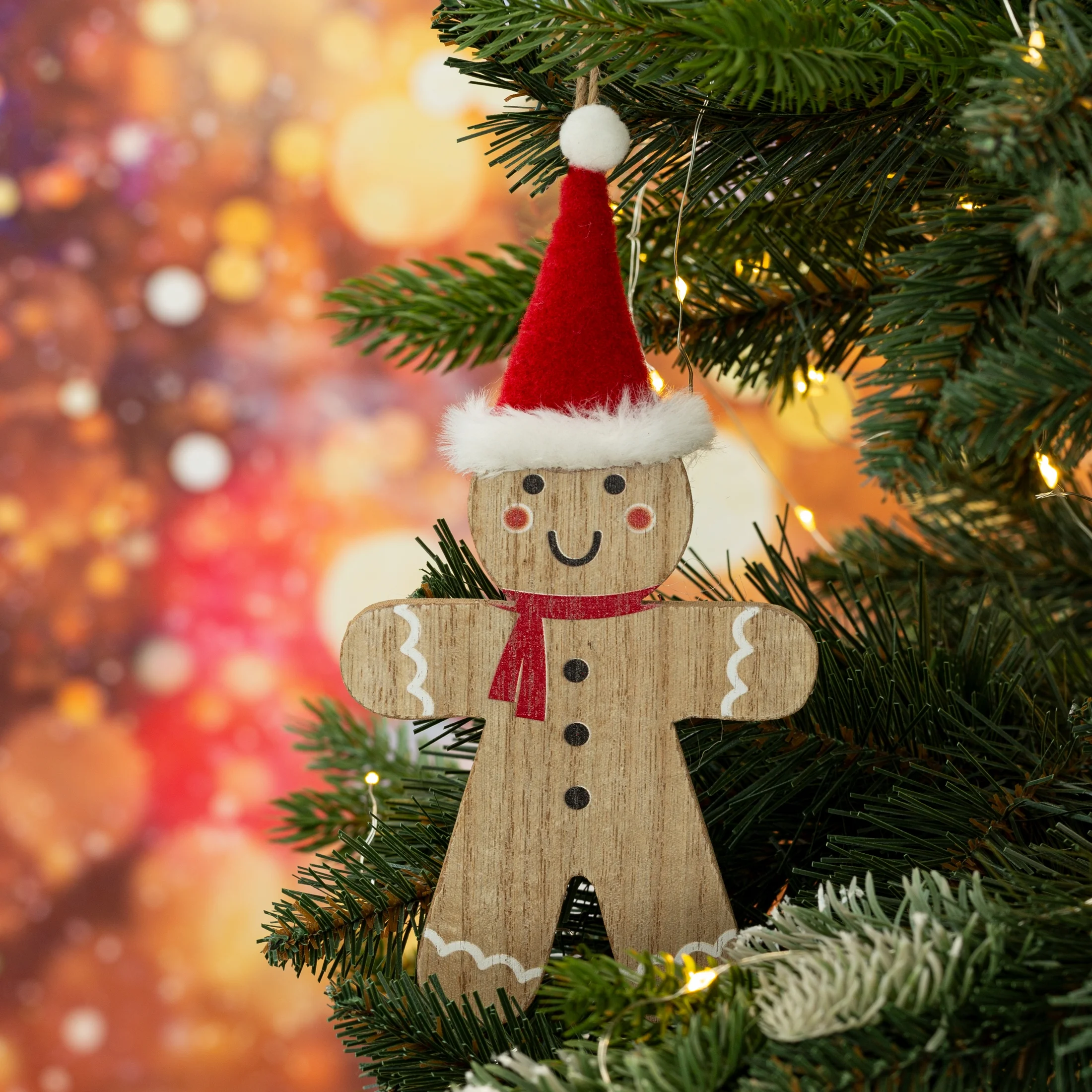 Ozdoba choinkowa w kształcie ludzika z piernika z czapeczką Mikołaja w stylu eko | eurofirany