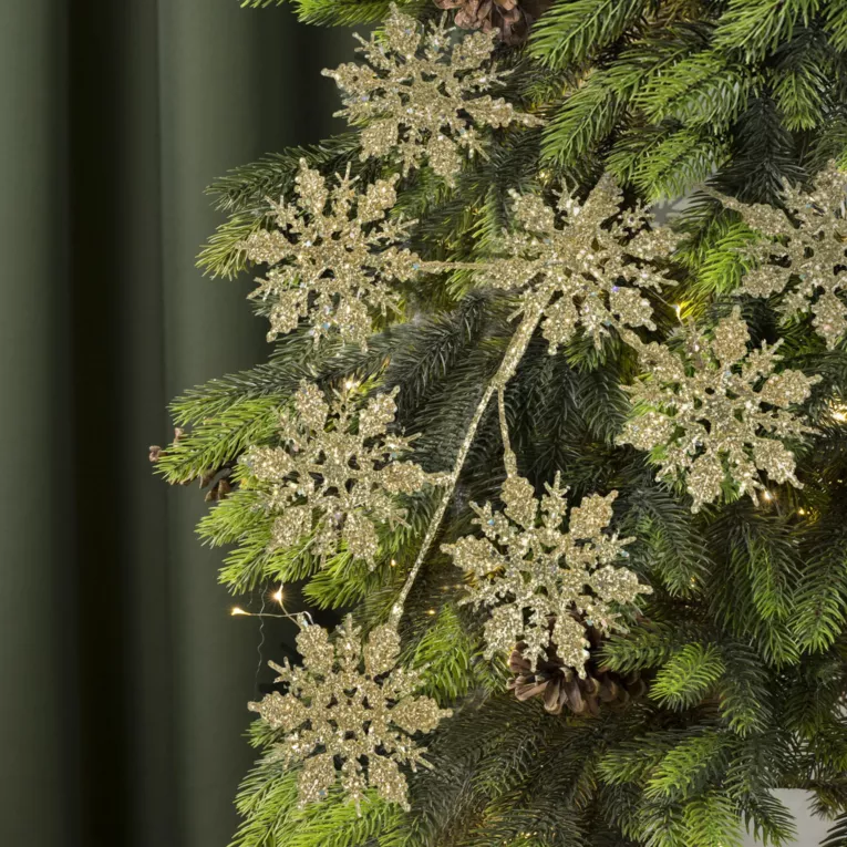 Zimowa gałązka śnieżynka obsypana szampańskim brokatem