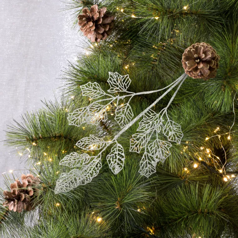 Gałązka dekoracyjna z ażurowymi listeczkami obsypanymi brokatem