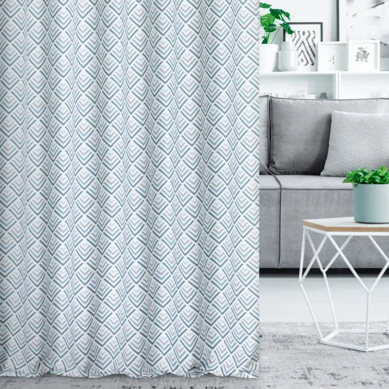 Zasłona szyta na tunelu jasnokremowo turkusowa z tkaniny o naturalnym splocie z nadrukowanym geometrycznym wzorem