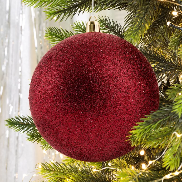 Bombka choinkowa obsypana lśniącym brokatem