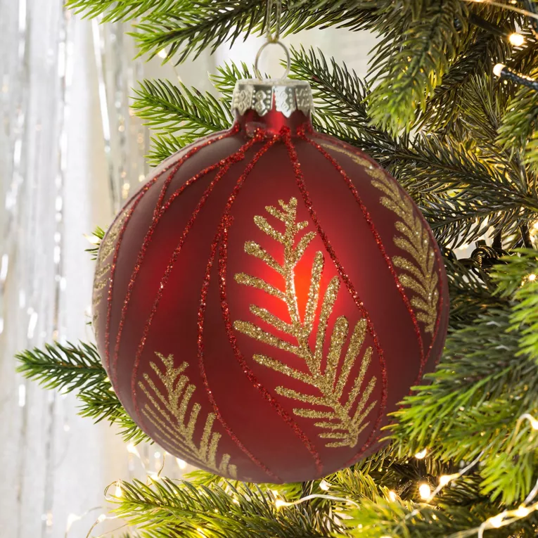 Bombka szklana ręcznie zdobiona brokatowym motywem gałązek