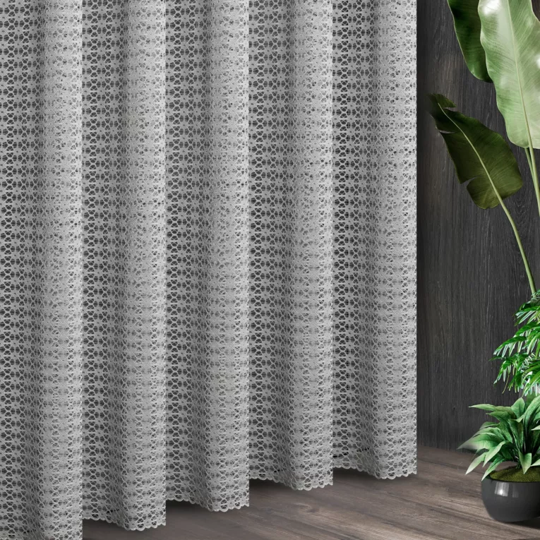Tkanina firanowa o strukturze ażurowej koronki