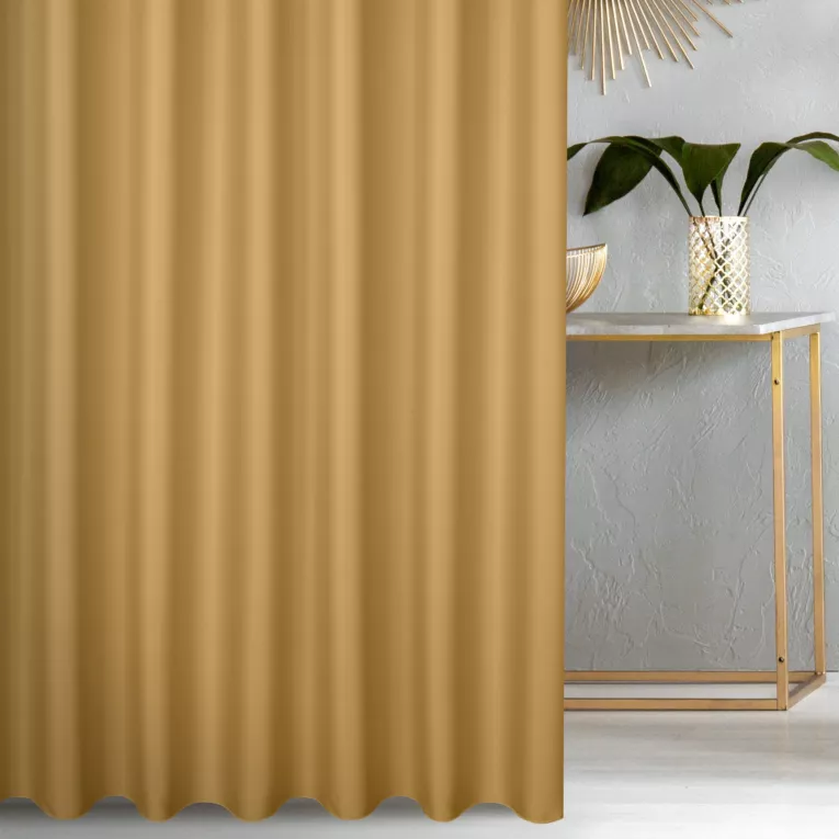 Zasłona szyta na flexach musztardowa z gładkiej tkaniny zaciemniającej typu dimout wykończona obciążnikiem