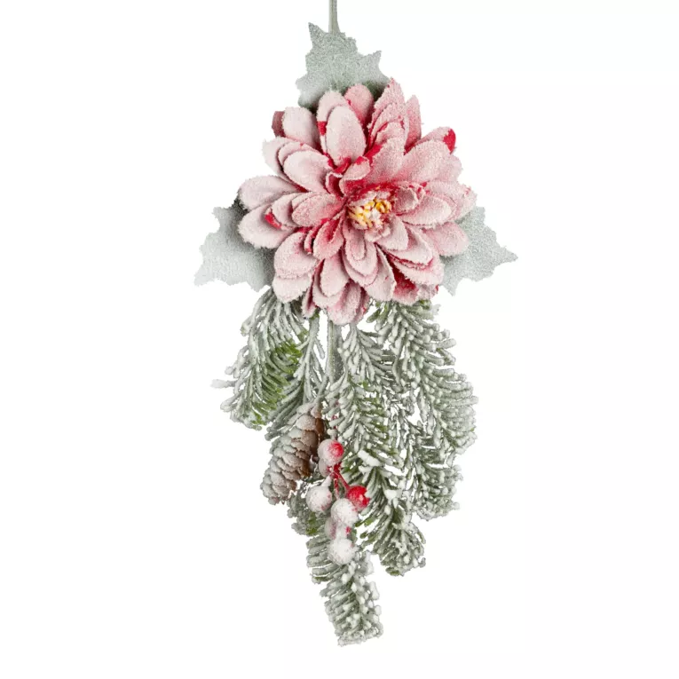 Świąteczny kwiat dekoracyjny z gałązkami obsypany śniegiem