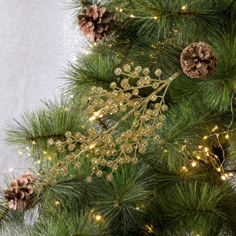 Gałązka zimowa ze złotymi kuleczkami obsypana złotym brokatem