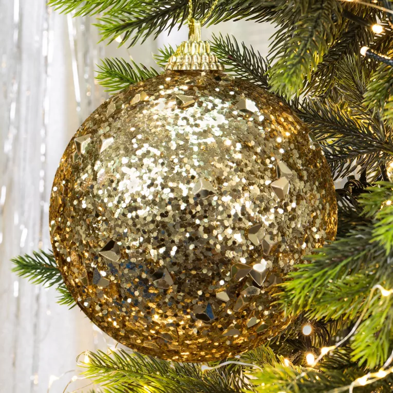 Bombka choinkowa oprószona brokatem i lśniącymi kryształkami