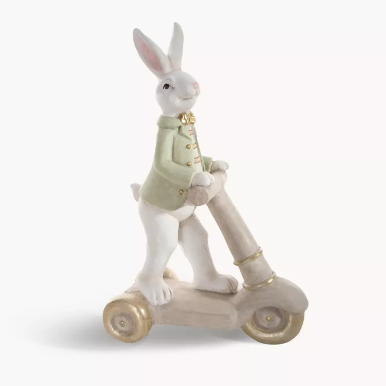 Wielkanocna figurka dekoracyjna uroczego zajączka na hulajnodze w miętowo, beżowej kolorystyce