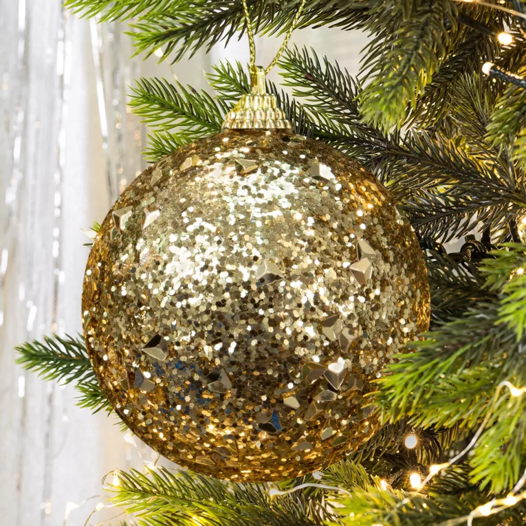 Bombka choinkowa oprószona brokatem i lśniącymi kryształkami