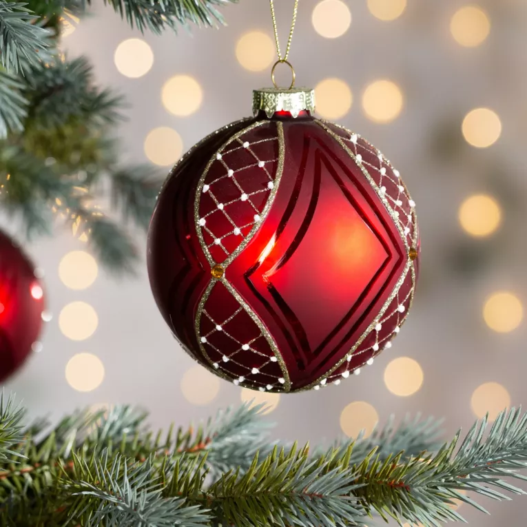Szklana bombka choinkowa ręcznie zdobiona błyszczącym wzorem