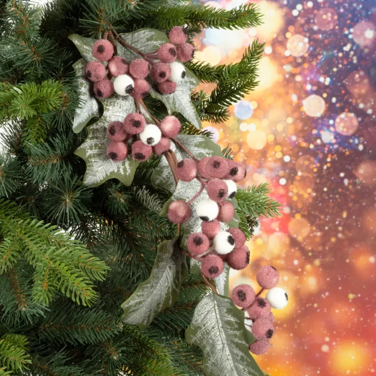 Zimowa gałązka z owocami i mrożonymi listeczkami