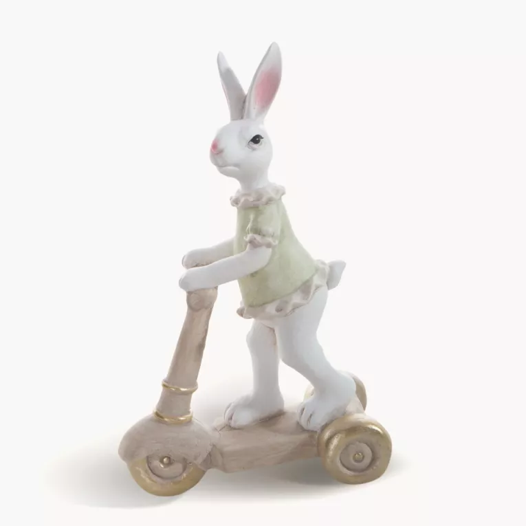 Wielkanocna figurka dekoracyjna uroczego zajączka na hulajnodze w miętowo, beżowej kolorystyce