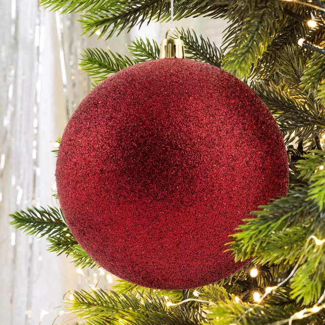 Bombka choinkowa obsypana lśniącym brokatem