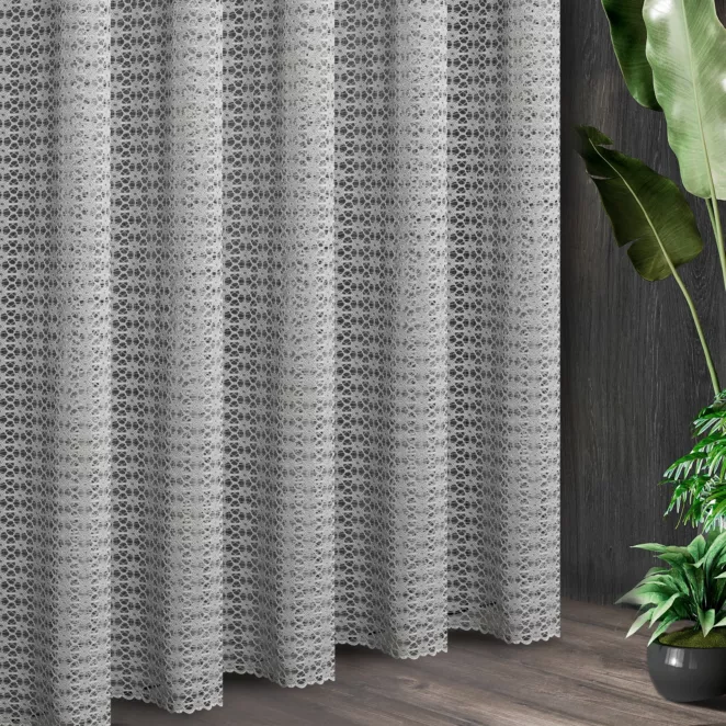 Tkanina firanowa o strukturze ażurowej koronki