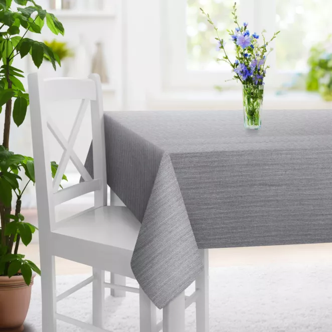 Obrus szyty jasnoszary z tkaniny z efektem melanżu wykończona obciążnikiem