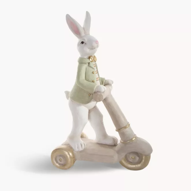 Wielkanocna figurka dekoracyjna uroczego zajączka na hulajnodze w miętowo, beżowej kolorystyce