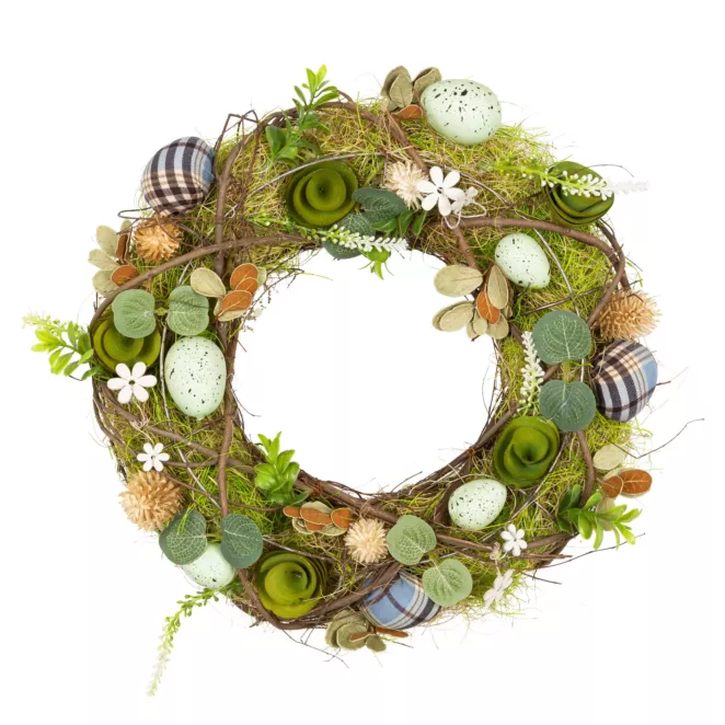 Wielkanocny wianek wyplatany z naturalnych gałązek z pisankami