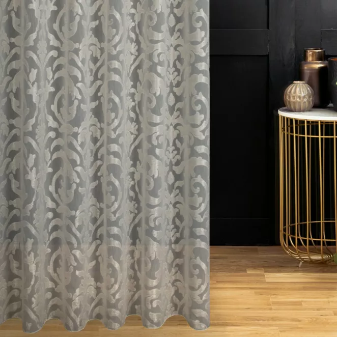 Firana szyta na taśmie 5 cm kremowo szampańska ekskluzywna z połyskliwym wzorem ornamentowym, wykończona obciążnikiem Italissima Eva Minge