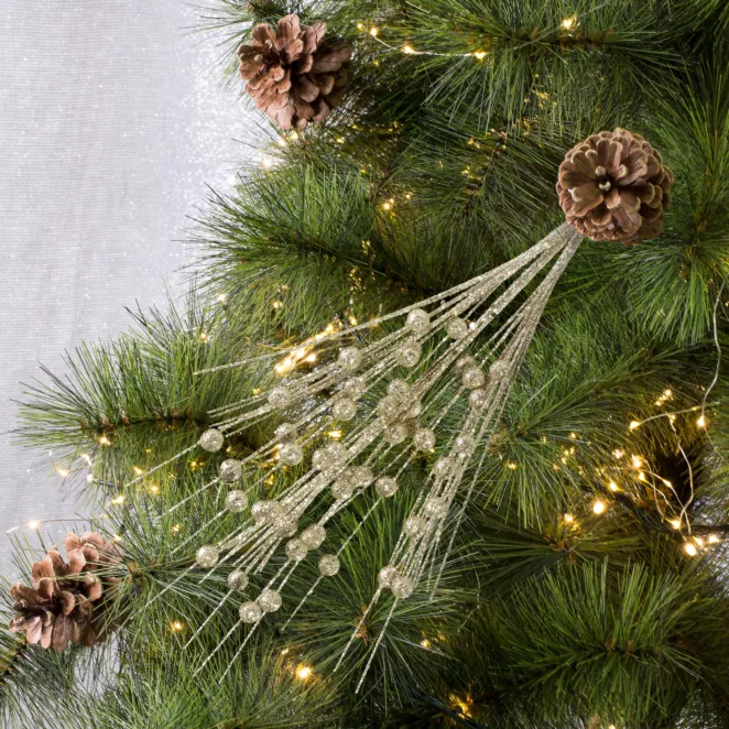 Zimowa gałązka dekoracyjna obsypana złotym brokatem