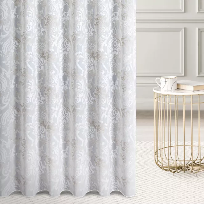 Firana szyta na taśmie 5 cm naturalno beżowa z ekskluzywnej tkaniny z dodatkiem wiskozy w ornamentowy wzór, wykończona obciążnikiem Italissima Eva Minge