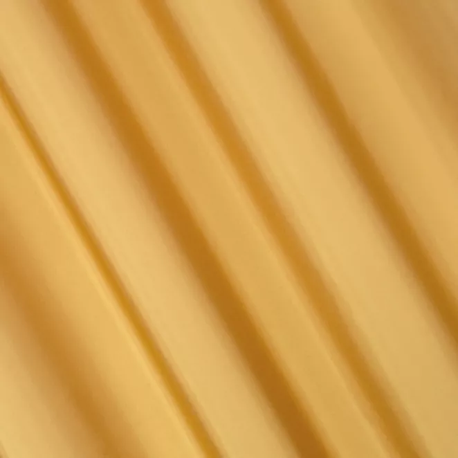 L108/5 Zasłona szyta na taśmie 5 cm złota z gładkiej tkaniny z delikatnym połyskiem