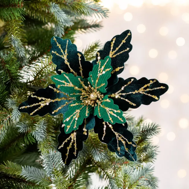 Świąteczny kwiat choinkowy z lśniącymi akcentami