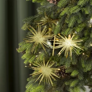 Fantazyjna zimowa gałązka obsypana złotym brokatem