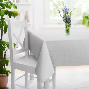 Obrus szyty kremowo srebrny z tkaniny o strukturze siatki z efektem melanżu