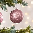 Bombka choinkowa obsypana lśniącym brokatem