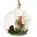 Szklana bombka z otworem zdobiona uroczym ptaszkiem w gniazdku