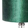 Lampa stołowa do pokoju ciemnozielona KIM na podstawie z przezroczystego szkła z abażurem z lśniącego welwetu