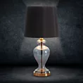 Lampa stołowa nocna czarno, złota EMILIO na podstawie z przezroczystego szkła z abażurem z matowej tkaniny