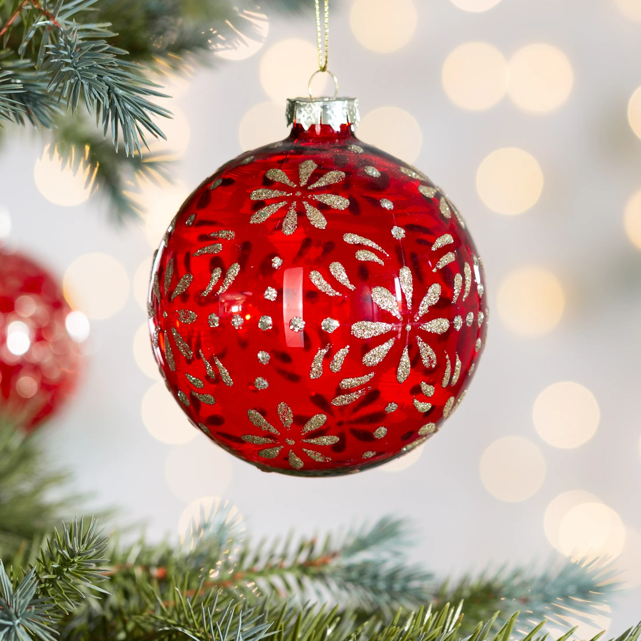 Szklana bombka ręcznie zdobiona wzorem kwiatów |